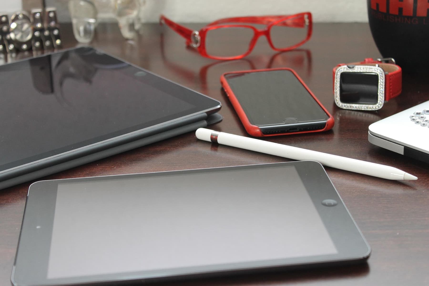 Tabletop devices including glasses, a phone, and tablets